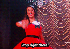 a woman in a red dress is saying stop right there .