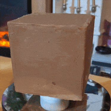 a block of chocolate with the letter e on top of it
