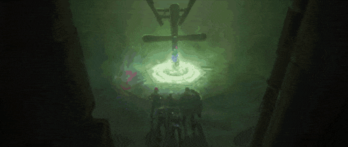 a group of people are standing in a dark room with a light coming out of a hole in the floor .