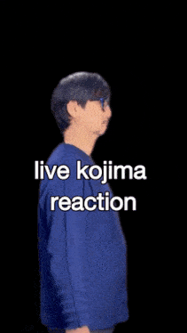 a man wearing glasses and a blue shirt with the words live kojima reaction on it