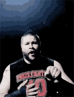 a man wearing a black tank top that says battlefield 1 on it