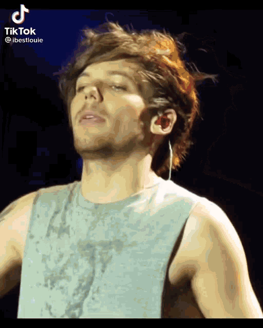a close up of a man 's face with a tiktok watermark on the bottom