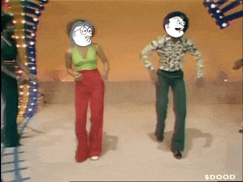 a man and a woman are dancing on a stage with a cartoon face on their faces
