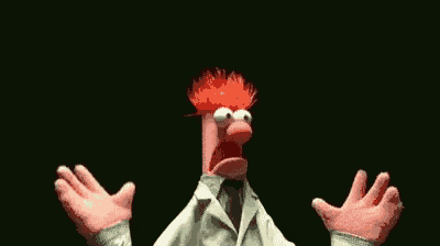 a muppet with red hair and a white coat and tie is spreading his arms .