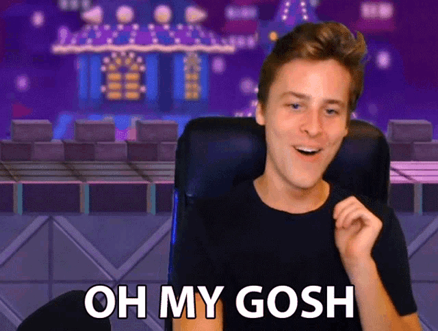 a man sitting in front of a screen that says oh my gosh on it