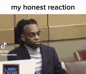 a man in a suit and turtleneck is sitting in a courtroom with his eyes closed .