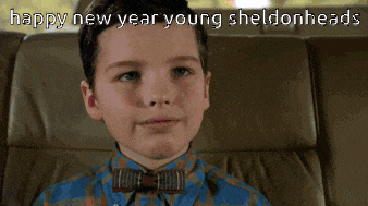 a young boy wearing a bow tie says happy new year