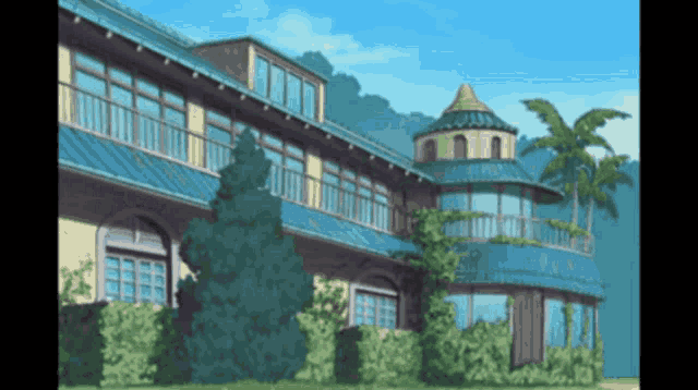 a large building with a blue roof and a tower on top