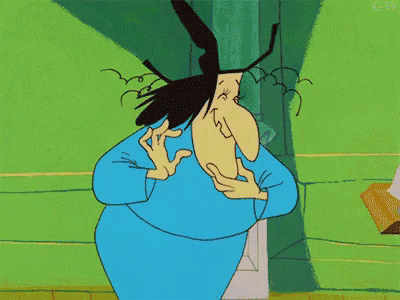 a cartoon character is wearing a blue shirt and making a face .