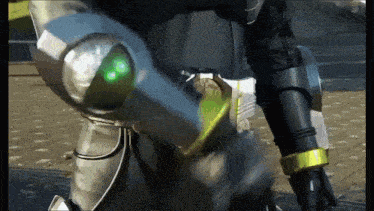 a close up of a person 's arm with green lights