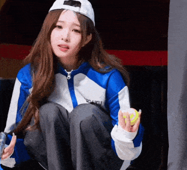 a girl wearing a blue and white jacket with the word gaku written on it