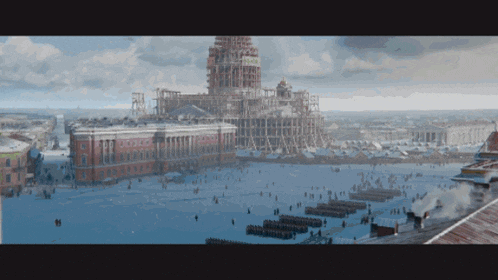a large building under construction is surrounded by snow covered buildings