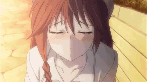 a close up of a girl 's face with her eyes closed