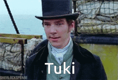 a man in a top hat with the word tuki written on his face