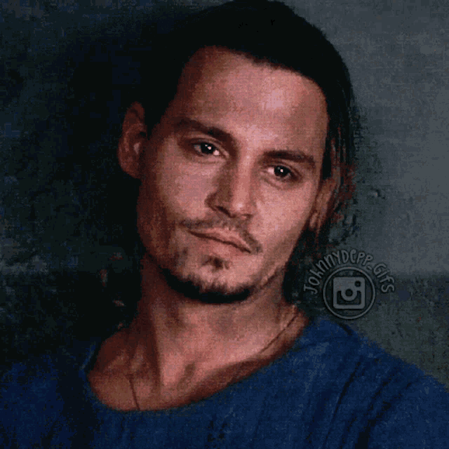 a close up of a man 's face with the words johnnydepp.gifs visible