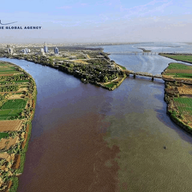 an aerial view of a river with the global agency logo