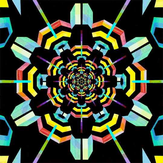 a colorful kaleidoscope on a black background with a rainbow colored center