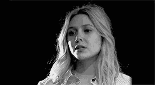a black and white photo of a woman 's face .