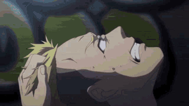 a close up of a person 's face with a tear coming out of their eye