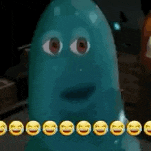 a blue ghost with a face and a row of smiley faces around it .