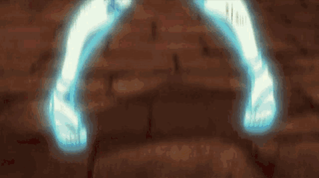a person is standing on a brick floor with their feet glowing in blue light .