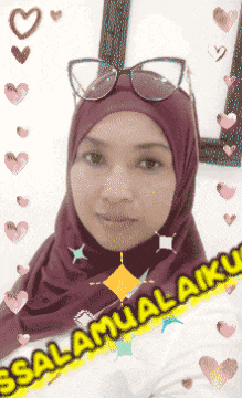 a woman wearing a hijab and sunglasses is surrounded by hearts and says " selamat malamku "