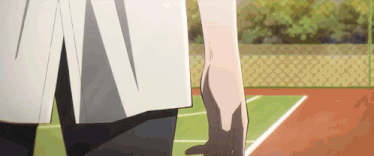 a person standing on a tennis court with their hand on their knee