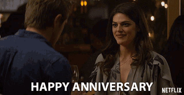 a netflix advertisement shows a man and a woman and says " happy anniversary "