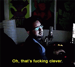 a man is singing into a microphone with the words oh that 's fucking clever