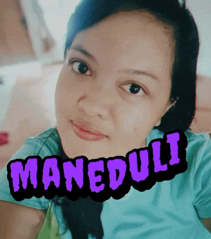 a woman in a blue shirt has the word maneduli written on her face