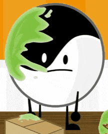 a black and white circle with a green leaf on it 's face .
