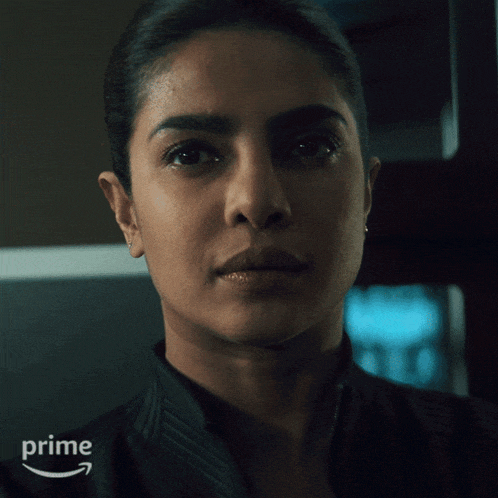 a close up of a woman 's face with an amazon prime logo