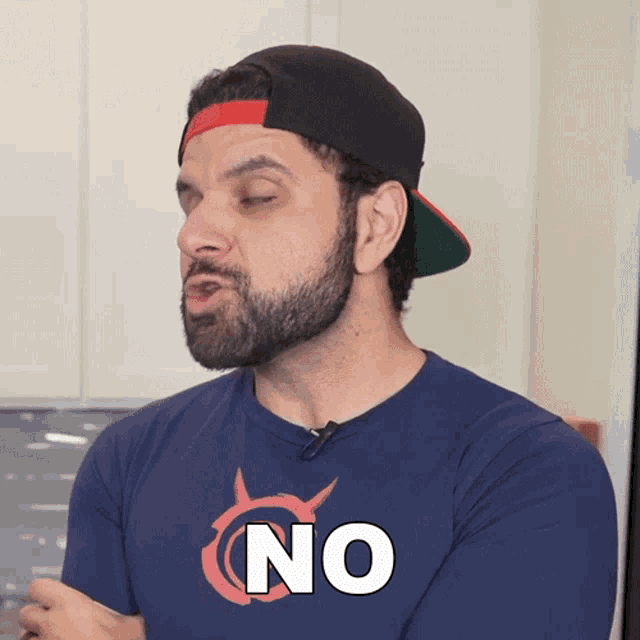 a man with a beard wearing a blue shirt that says no