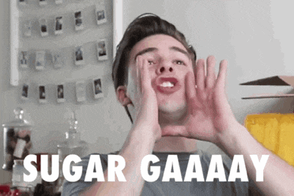 a man making a funny face with the words sugar gaaaay on the bottom right