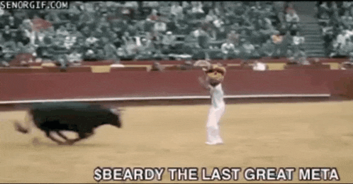 a man stands in front of a bull in a bullfight and says " $beardy the last great meta " at the bottom