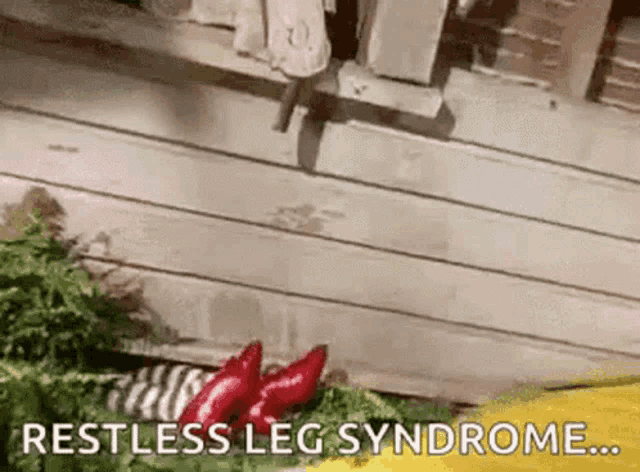 a person with restless leg syndrome is standing on a wooden floor .