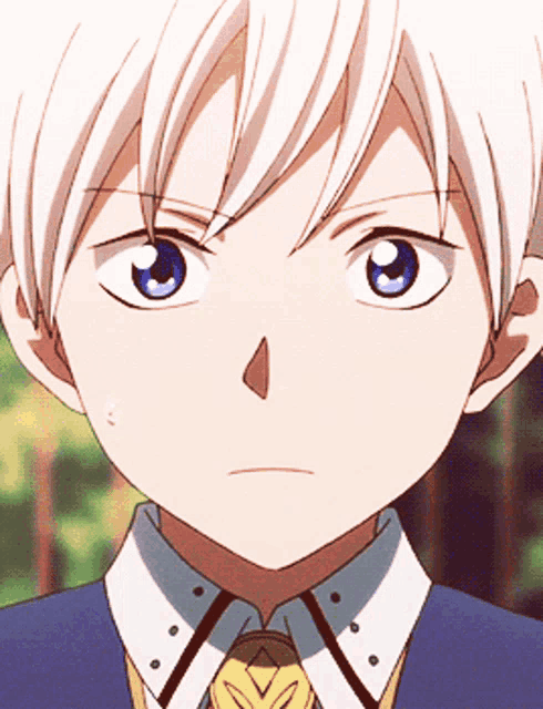 a young boy with white hair and blue eyes is wearing a blue shirt and tie
