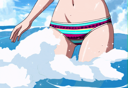 a woman in a bikini stands in the water