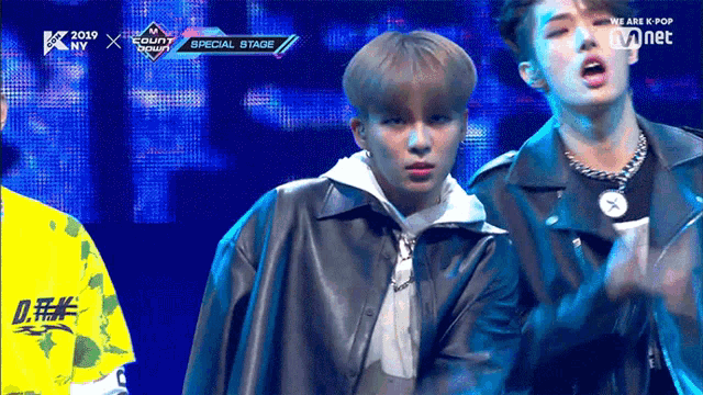 a group of young men are performing on a stage with the words special stage behind them