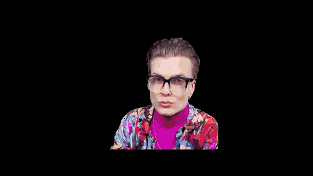 a young man wearing glasses and a purple turtleneck is looking at the camera .