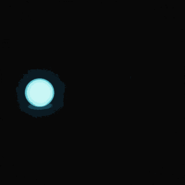 a blue circle in the middle of a dark room