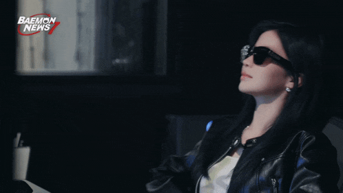 a woman wearing sunglasses with the name a-sa on the bottom right