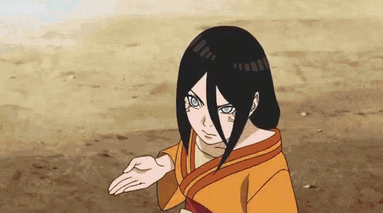 a girl with long black hair and blue eyes is wearing an orange shirt