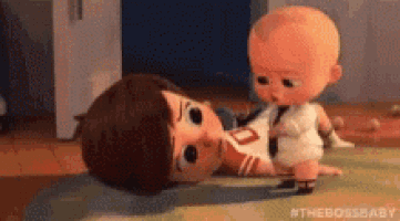 a cartoon baby is laying on the floor next to a baby doll .