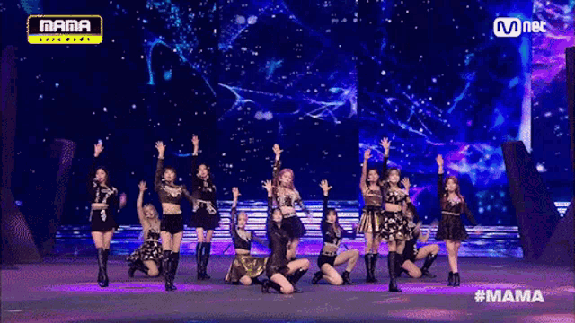 a group of women are dancing on a stage with the words mama on the bottom