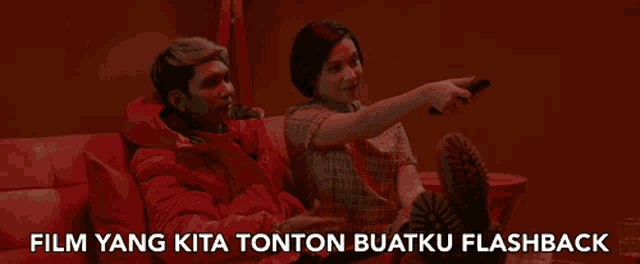 a man and a woman are sitting on a couch with the words film yang kita tonton buatku flashback written below them
