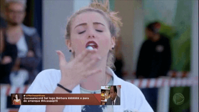 a woman is eating a white item with a caption that says " a casarecord " on it