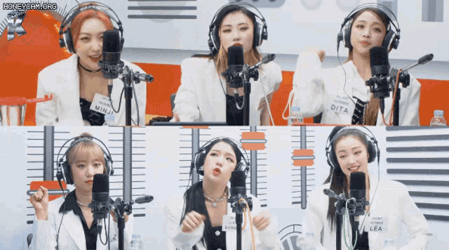 a group of women wearing headphones with one wearing a shirt that says ' dita ' on it