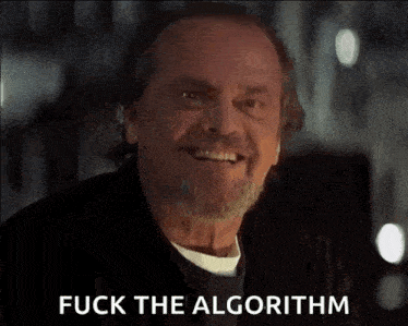 a man with a beard is smiling and saying fuck the algorithm .