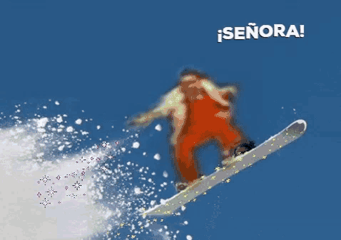 a snowboarder is flying through the air with the words señora behind him